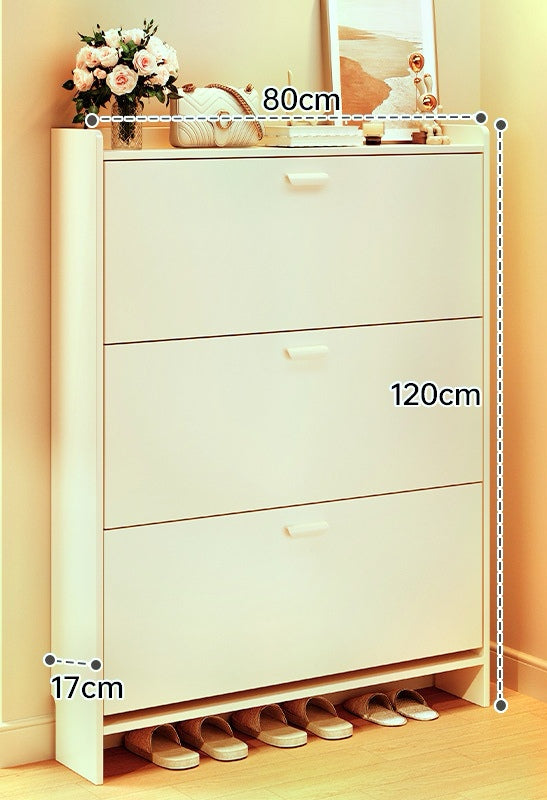 White shoe cabinet with dimensions marked on a light wooden floor.