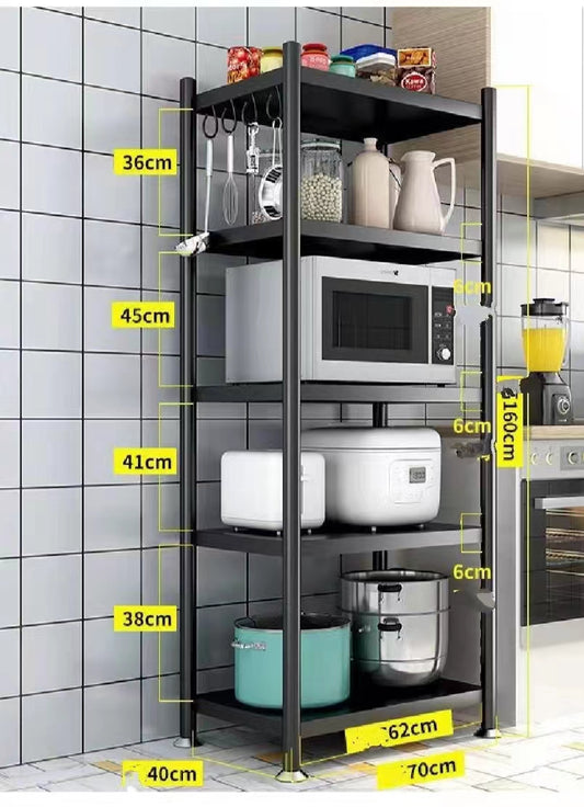 Kitchen shelf with various appliances and items, showing measurements against a tiled wall.